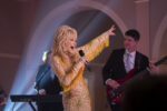 Dolly performing in a still from her Netflix christmas movie