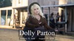 Dolly Parton with a guitar in front of an old west setting