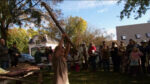 Straightest Stick Contest Winner holds up big stick