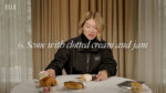 Lea Seydoux looks skeptically at a scone