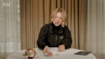 Lea Seydoux looks skeptically at macarons