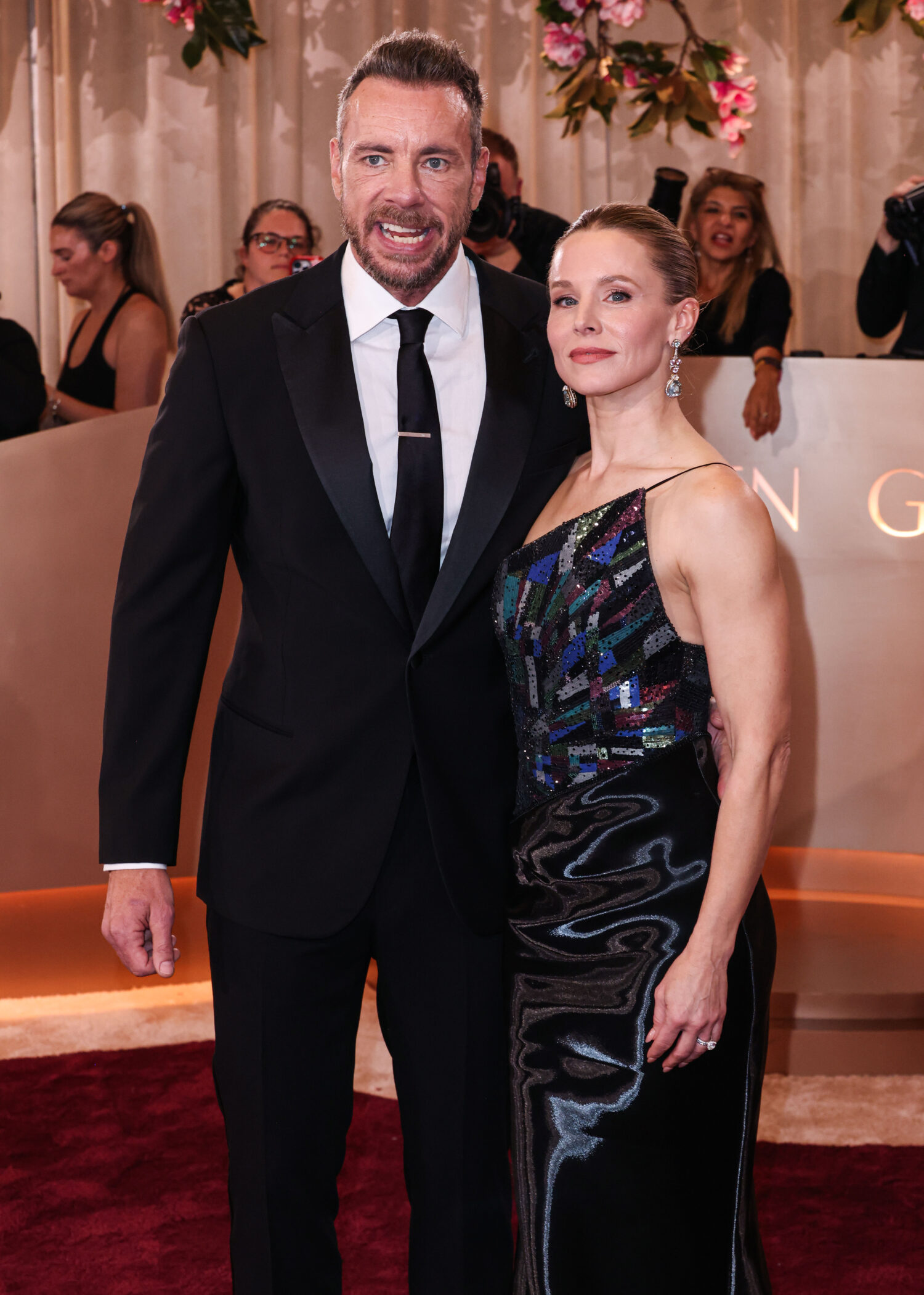 Dax Shepard wearing a Giorgio Armani tux and wife Kristen Bell wearing a Giorgio Armani Prive dress and Sabyasachi Jewelry arrive at the 83rd Annual Golden Globe Awards 1-13-26